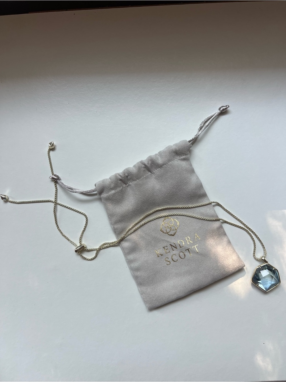 Kendra Scott Gold Necklace with Light Blue Faceted Pendant - Picture 2 of 5